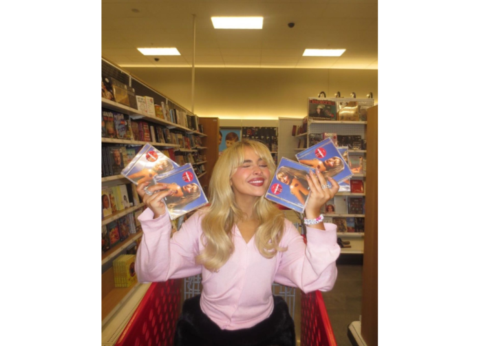 Rich and Diverse Ethnicity of Short N’ Sweet’s Popstar, Sabrina Carpenter Sabrina Carpenter holding her album copies of Short N' Sweet